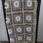 Daisy babydeken in aarde tinten